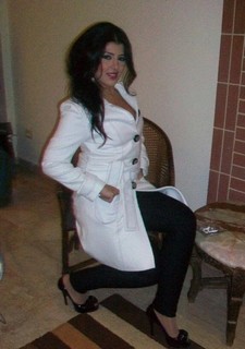 Belly dancer in white coat. Wearing Nice Coat.