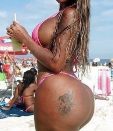 Beach girl with big tattoo butt & big breasts in bikini