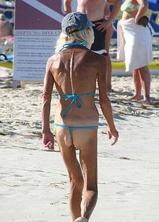 Skinny old lady on the beach